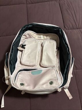 Pale Pink Travel Backpack with Multiple Organizer Pockets